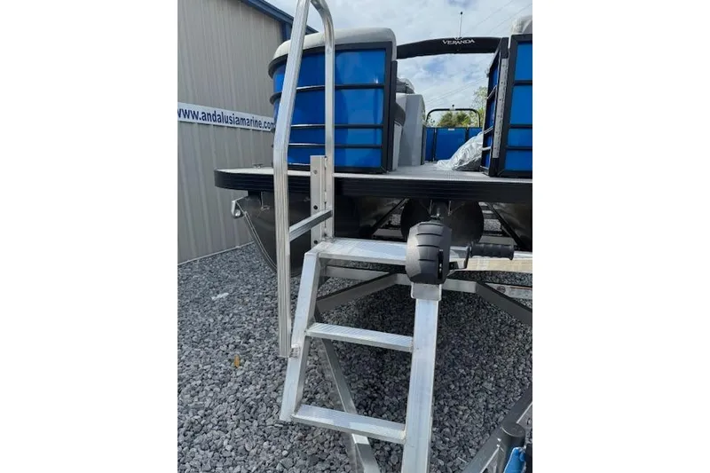 Slide: The Image of 2026 Veranda VV22RC pontoon boat with aluminum ladder on gravel surface. - 7
