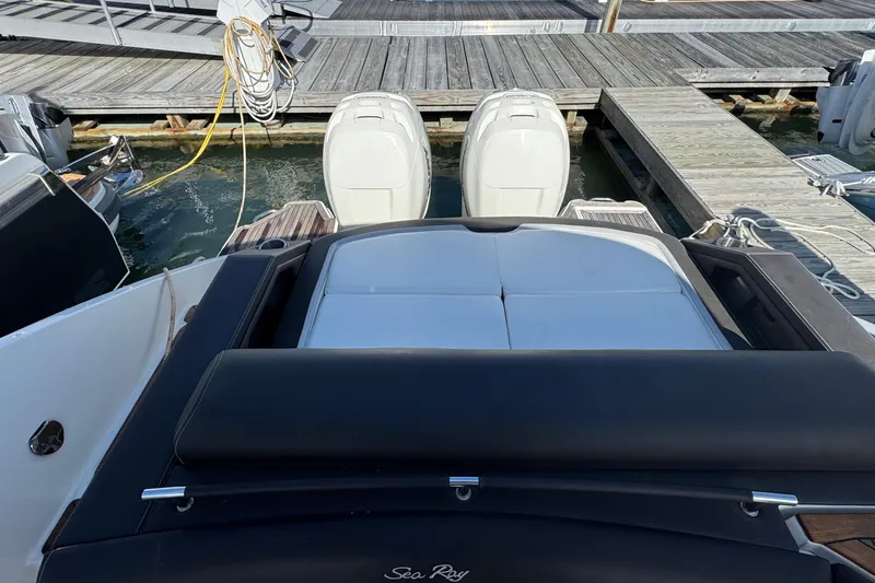Slide: The Image of 2017 Sea Ray SLX 310 Outboard at dock with dual engines visible. - 10