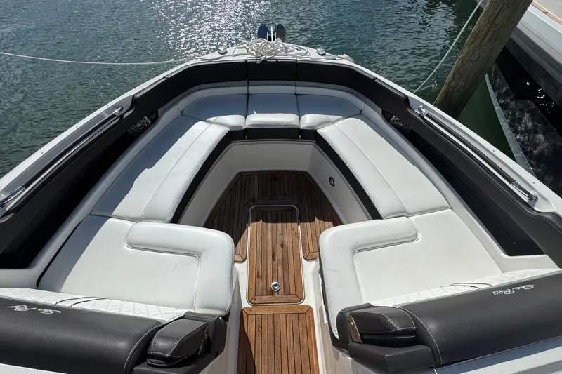 Slide: The Image of Luxurious 2017 Sea Ray SLX 310 Outboard boat with spacious seating and elegant wood flooring. - 31