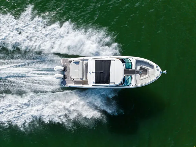 Slide: The Image of Luxurious interior of 2017 Sea Ray SLX 310 Outboard boat with elegant seating. - 37