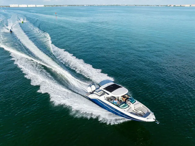 Slide: The Image of 2017 Sea Ray SLX 310 Outboard boat interior with luxurious seating and sleek design. - 38