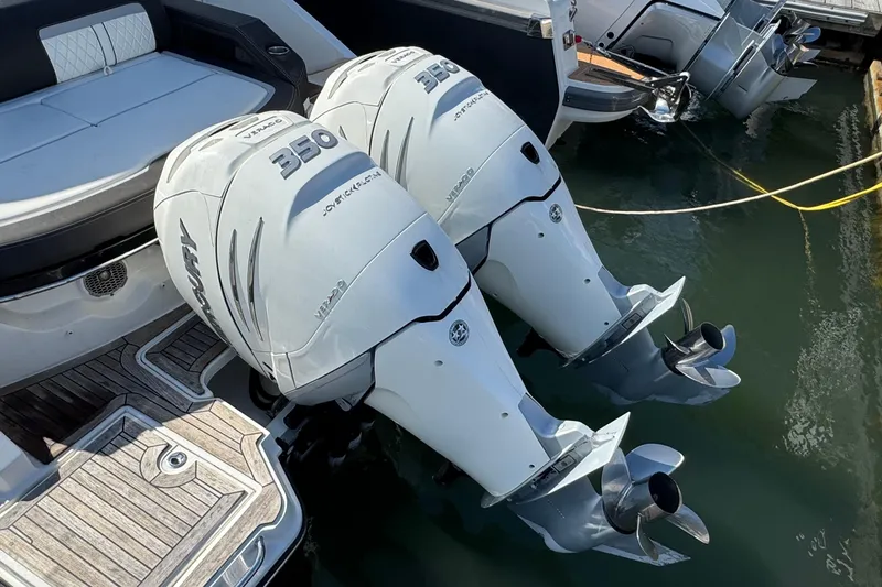 Slide: The Image of 2017 Sea Ray SLX 310 Outboard with twin 350 horsepower engines docked. - 6