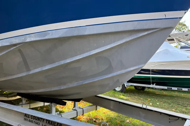 Slide: The Image of 1965 Bertram boat hull on trailer, showcasing sleek design and craftsmanship. - 16