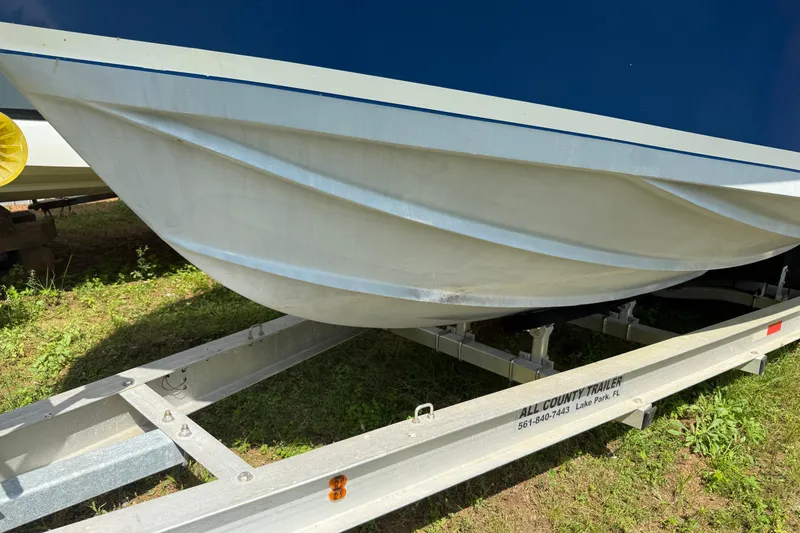 Slide: The Image of 1965 Bertram boat hull on trailer, showcasing sleek design and craftsmanship. - 3