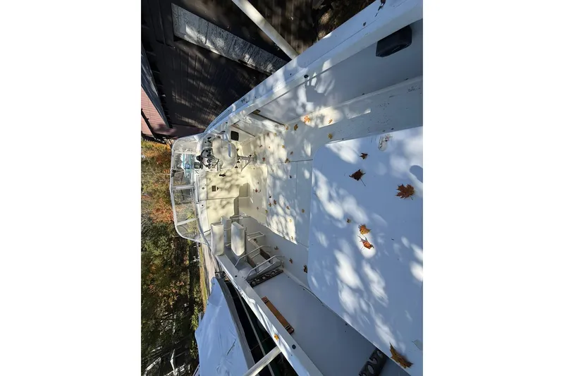 Slide: The Image of 1965 Bertram boat interior with fallen autumn leaves on deck. - 47