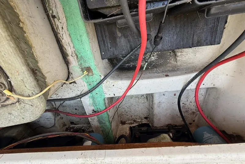 Slide: The Image of Interior view of a 1965 Bertram boat showing wiring and components. - 49