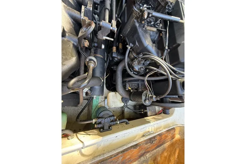 Slide: The Image of 1965 Bertram engine compartment with visible wiring and components. - 53