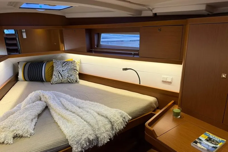 Slide: The Image of Luxurious cabin interior of 2014 Beneteau Oceanis 41 yacht with cozy bedding. - 9