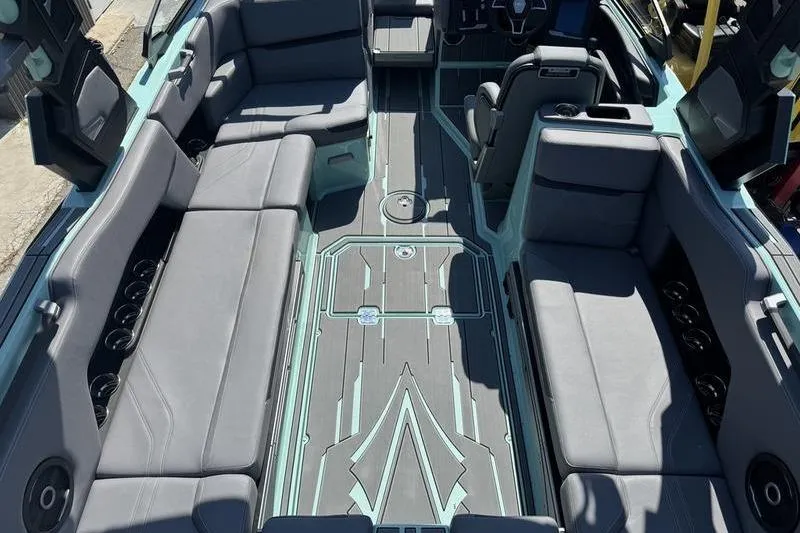 Slide: The Image of 2024 Supra SE 575 boat interior with spacious seating and modern design. - 13