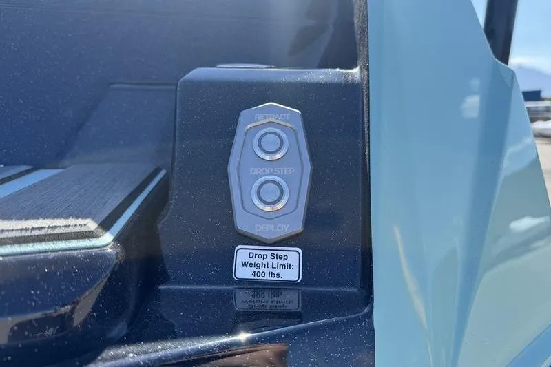 Slide: The Image of 2024 Supra SE 575 drop step control panel with 400 lbs weight limit. - 7