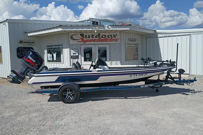 The Image of 2003 Skeeter TZX190 boat with Yamaha engine outside Outdoor Specialties shop. - 1