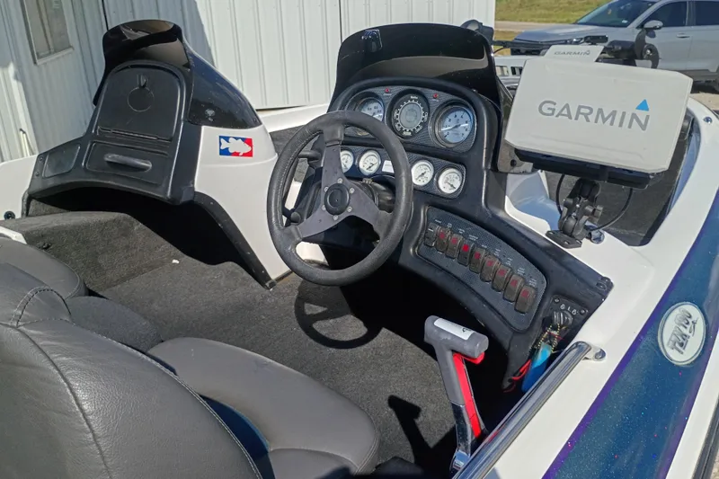 Slide: The Image of 2003 Skeeter TZX190 boat cockpit with Garmin GPS and control panel. - 3