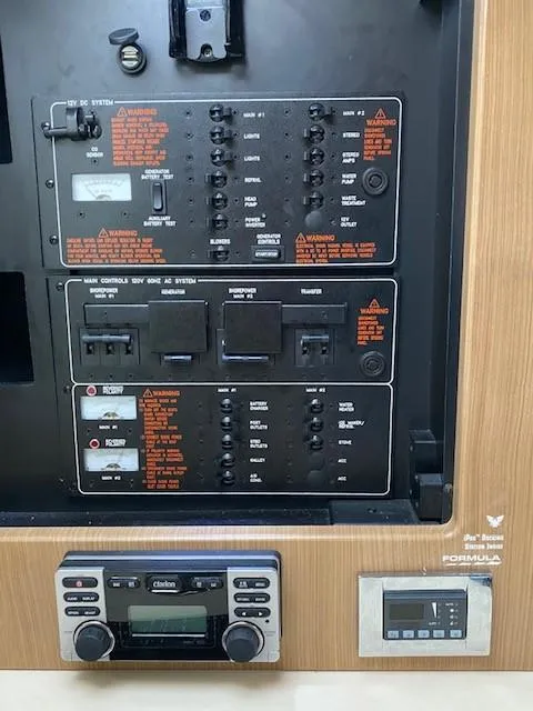 Slide: The Image of Control panel of a 2012 Formula 350 Sun Sport boat with electronic systems and switches. - 19