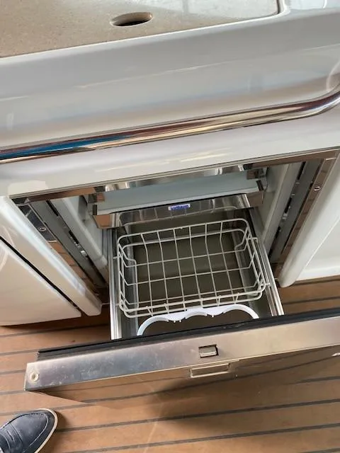 Slide: The Image of Open dishwasher on 2012 Formula 350 Sun Sport boat with wooden flooring. - 29