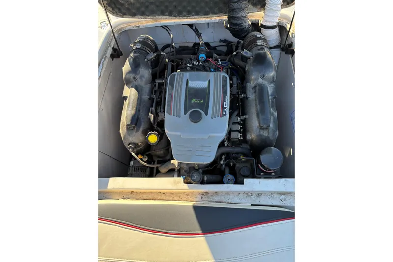 Slide: The Image of 2014 Tahoe 215 Xi boat engine compartment with 5.0 MPI motor. - 12