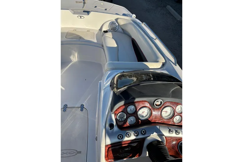 Slide: The Image of 2014 Tahoe 215 Xi boat interior with dashboard and seating area. - 7