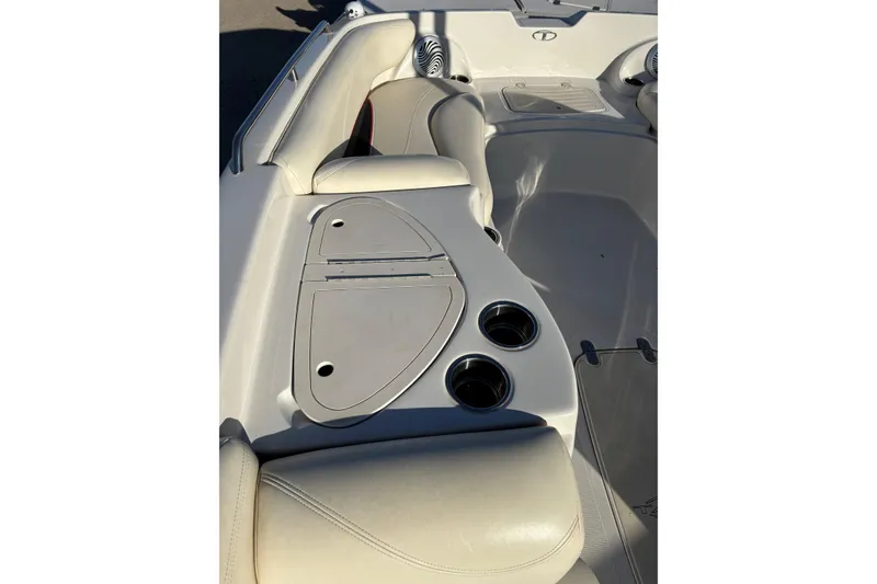 Slide: The Image of 2014 Tahoe 215 Xi boat interior with cup holders and seating. - 8