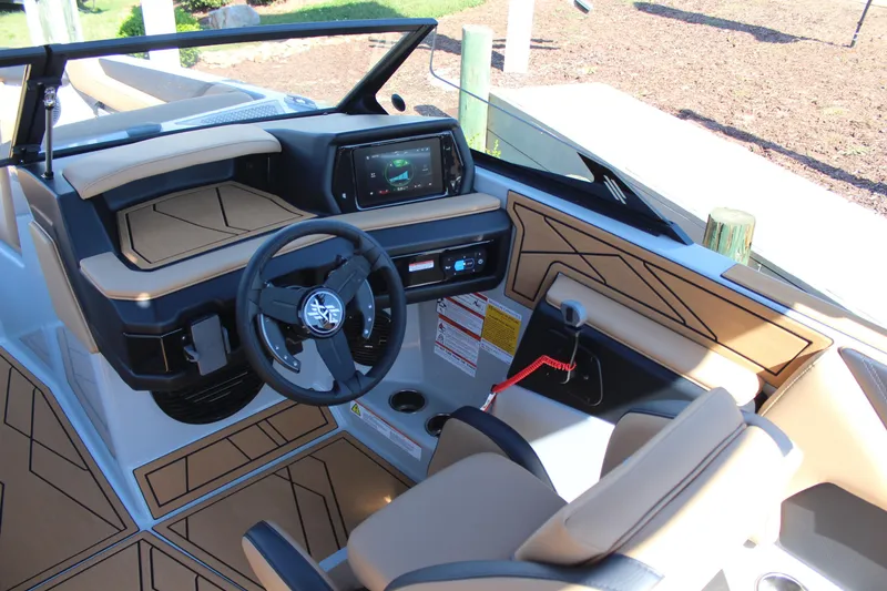 Slide: The Image of 2026 ATX Surf Boats 22 Type-S interior with modern dashboard and steering wheel design. - 13