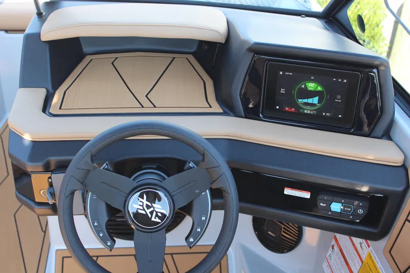Slide: The Image of 2026 ATX Surf Boats 22 Type-S dashboard with steering wheel and touchscreen display. - 14
