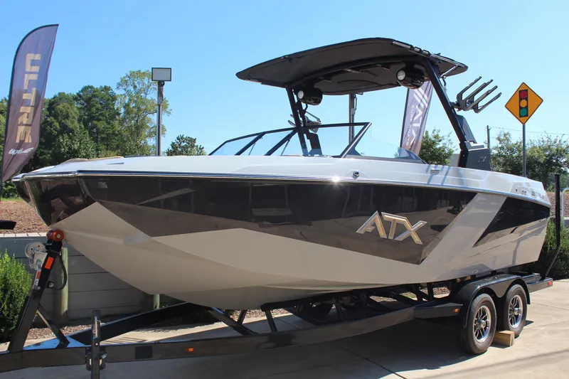 Slide: The Image of 2026 ATX Surf Boats 22 Type-S on trailer, displayed outdoors. - 4