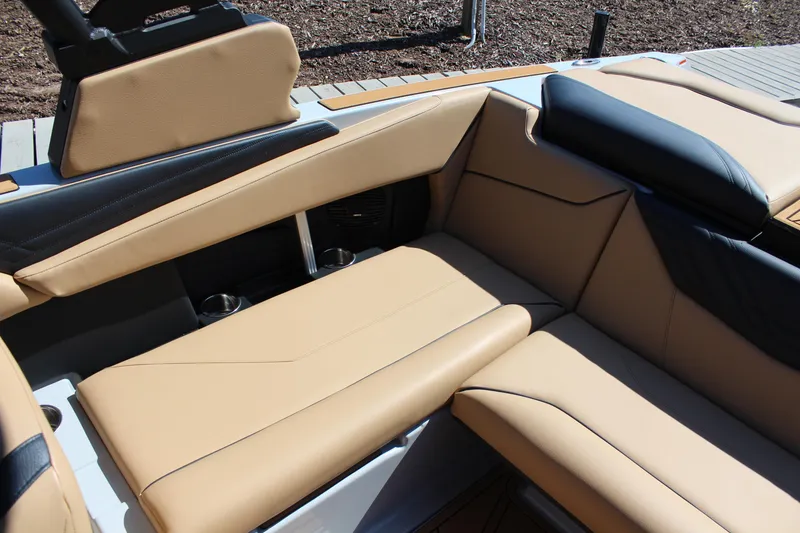 Slide: The Image of 2026 ATX Surf Boats 22 Type-S interior with tan and black seating. - 9