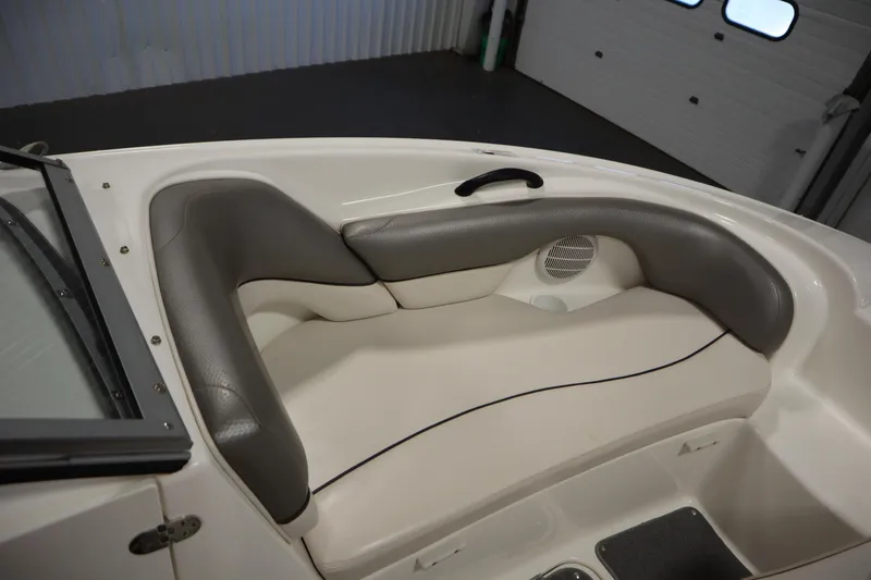 Slide: The Image of Interior seating of 2010 Yamaha 210 SX boat, featuring gray and white upholstery. - 14