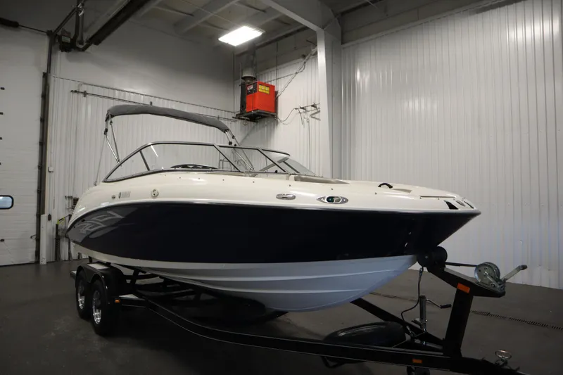 Slide: The Image of 2010 Yamaha 210 SX boat on trailer in indoor storage facility. - 3