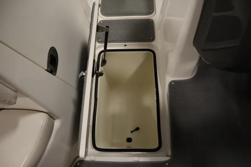 Slide: The Image of Open storage compartment in 2010 Yamaha 210 SX boat interior. - 31