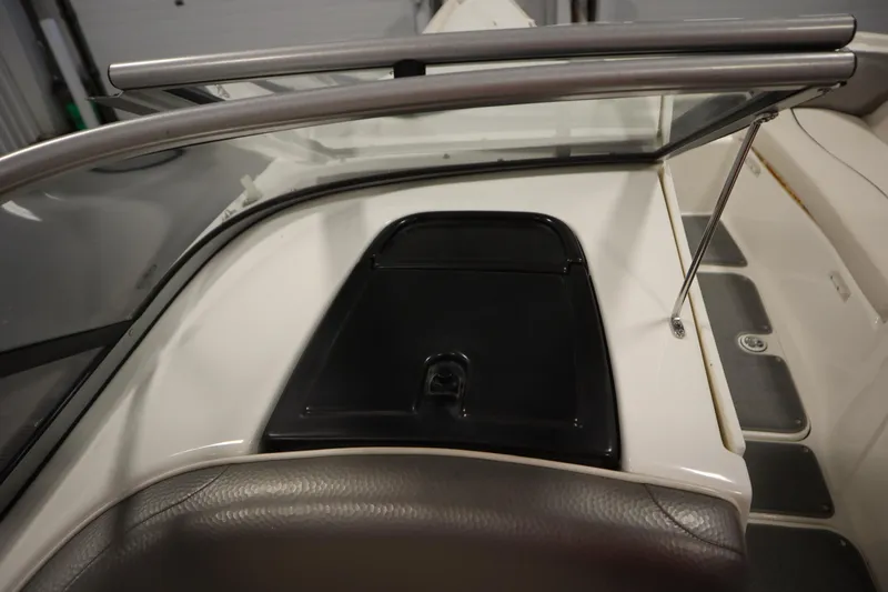 Slide: The Image of Interior view of a 2010 Yamaha 210 SX boat, featuring a sleek dashboard design. - 35