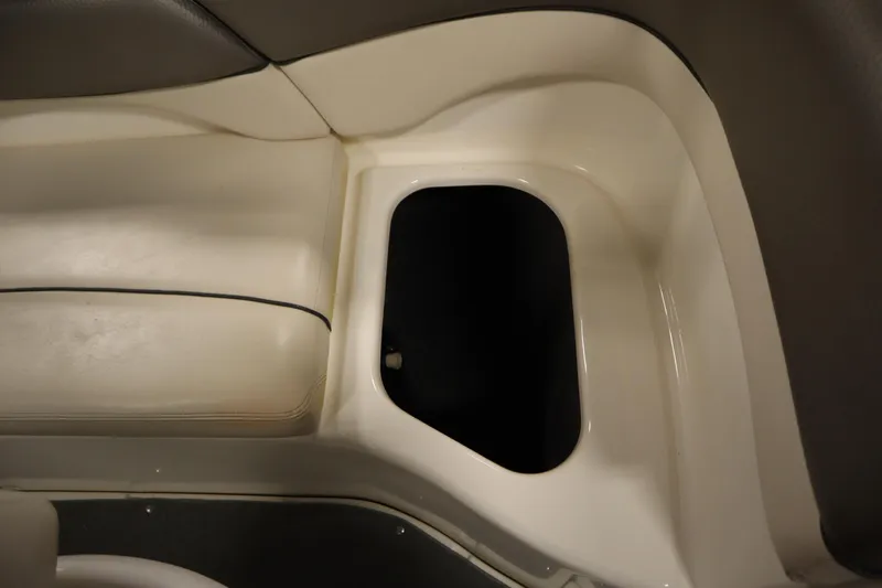 Slide: The Image of Interior seating and storage compartment of 2010 Yamaha 210 SX boat. - 38