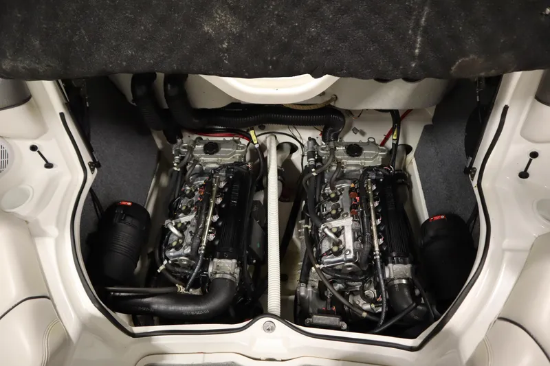 Slide: The Image of Engine compartment of 2010 Yamaha 210 SX boat, showcasing dual engines. - 39