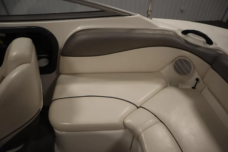 Slide: The Image of 2010 Yamaha 210 SX boat interior with beige seating and speaker. - 40