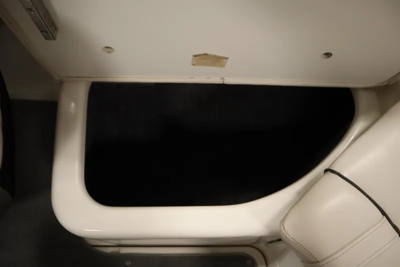 Slide: The Image of Interior compartment of 2010 Yamaha 210 SX boat, featuring white upholstery. - 41