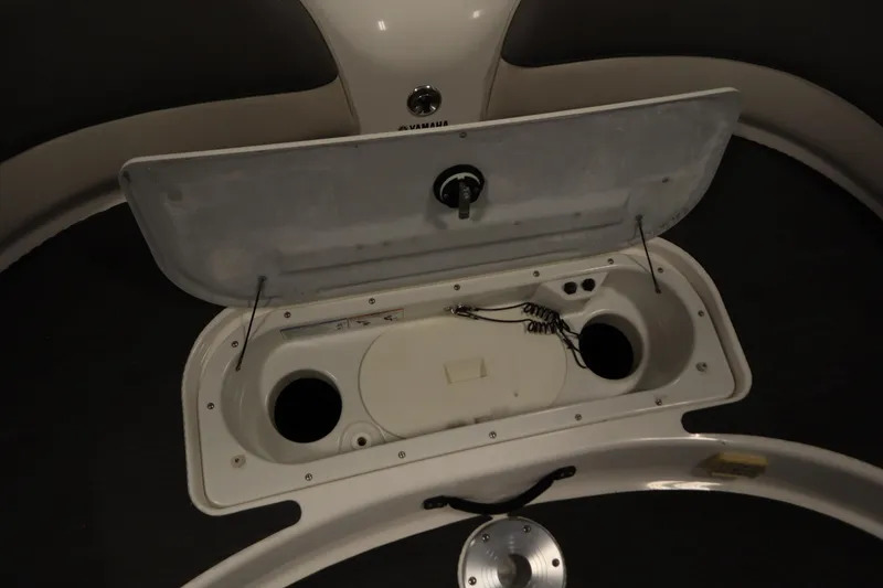 Slide: The Image of Open storage compartment on a 2010 Yamaha 210 SX boat, showing interior details. - 43
