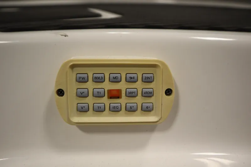 Slide: The Image of Control panel on a 2010 Yamaha 210 SX boat with various function buttons. - 45