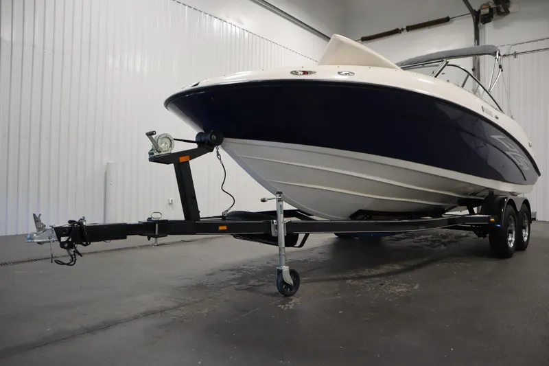 Slide: The Image of 2010 Yamaha 210 SX boat on trailer in indoor storage facility. - 49