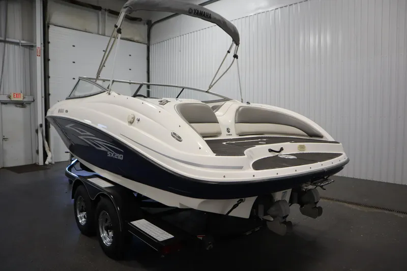 Slide: The Image of 2010 Yamaha 210 SX boat on trailer in indoor storage facility. - 7