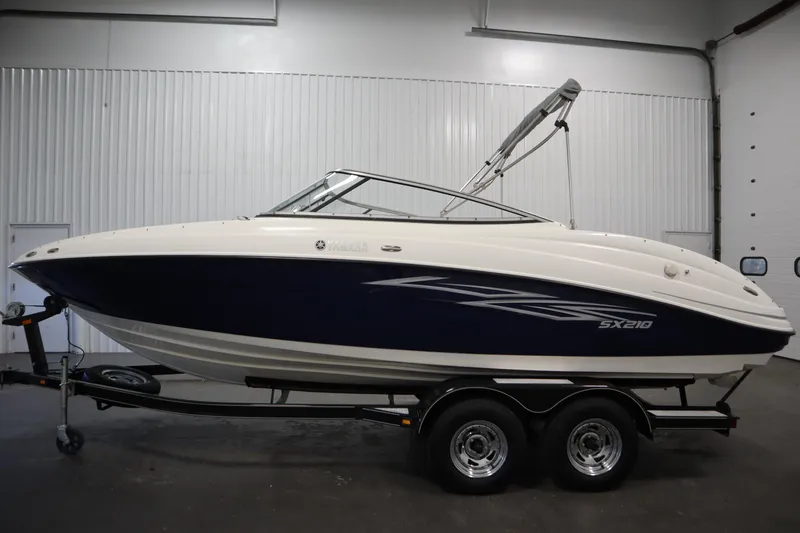 Slide: The Image of 2010 Yamaha 210 SX boat on trailer in indoor storage facility. - 8
