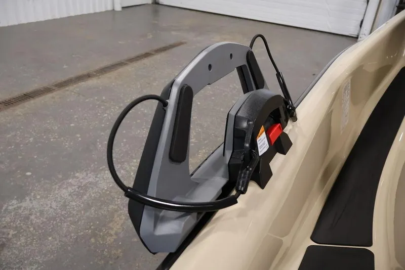 Slide: The Image of 2026 Sea-Doo Wake 170 jet ski with a wakeboard rack in a garage setting. - 20