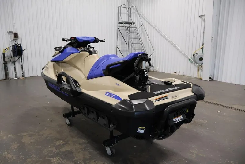 Slide: The Image of 2026 Sea-Doo Wake 170 jet ski in a garage setting, showcasing sleek design and features. - 3