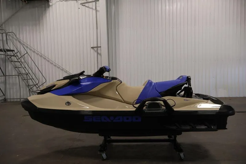 Slide: The Image of 2026 Sea-Doo Wake 170 jet ski in a garage, featuring a sleek design and vibrant colors. - 5