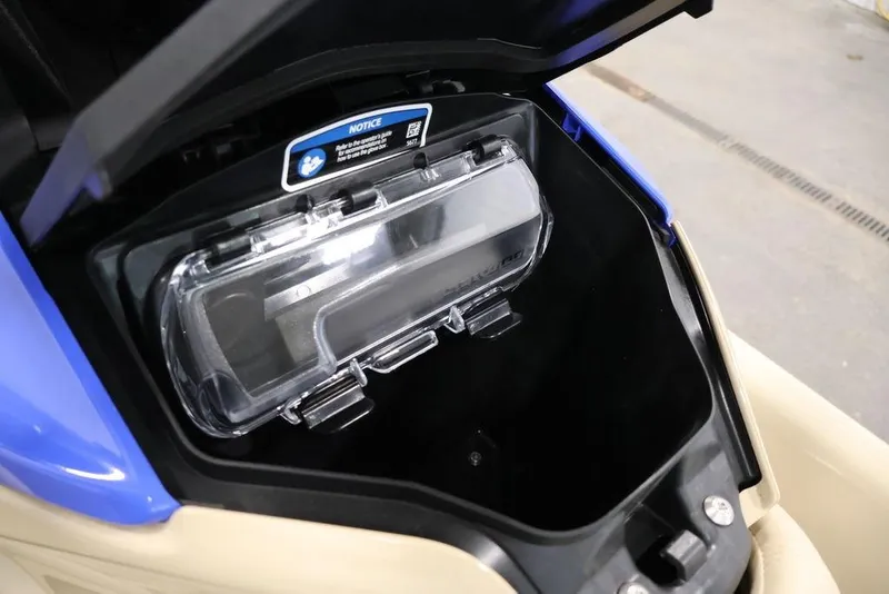 Slide: The Image of 2026 Sea-Doo Wake 170 storage compartment with clear cover, showcasing interior design. - 6