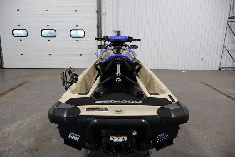 Slide: The Image of 2026 Sea-Doo Wake 170 jet ski in a garage, rear view showcasing design and features. - 7