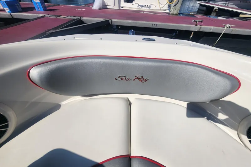 Slide: The Image of 2008 Sea Ray 205 Sport boat interior with logo, docked at marina. - 10