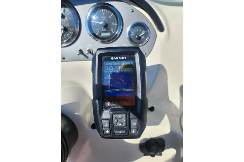 Slide: The Image of Garmin GPS on 2008 Sea Ray 205 Sport dashboard with speedometer and controls. - 11