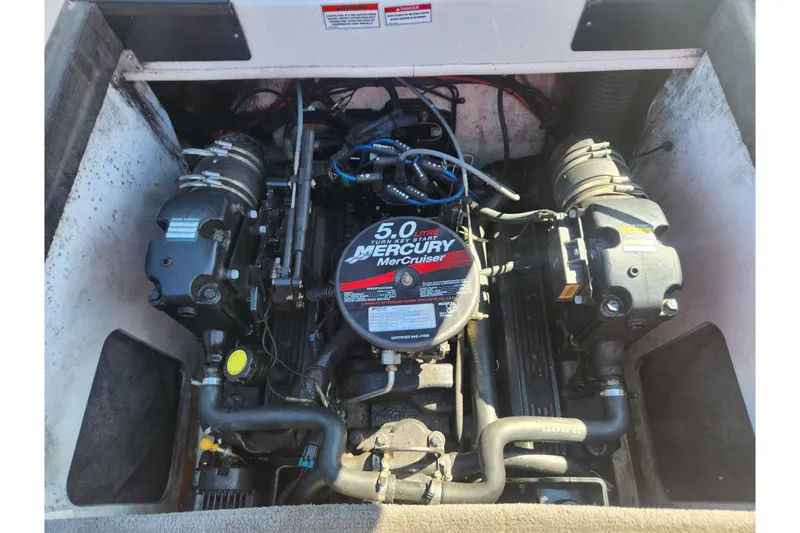 Slide: The Image of Engine compartment of a 2008 Sea Ray 205 Sport with a 5.0L Mercury MerCruiser. - 19