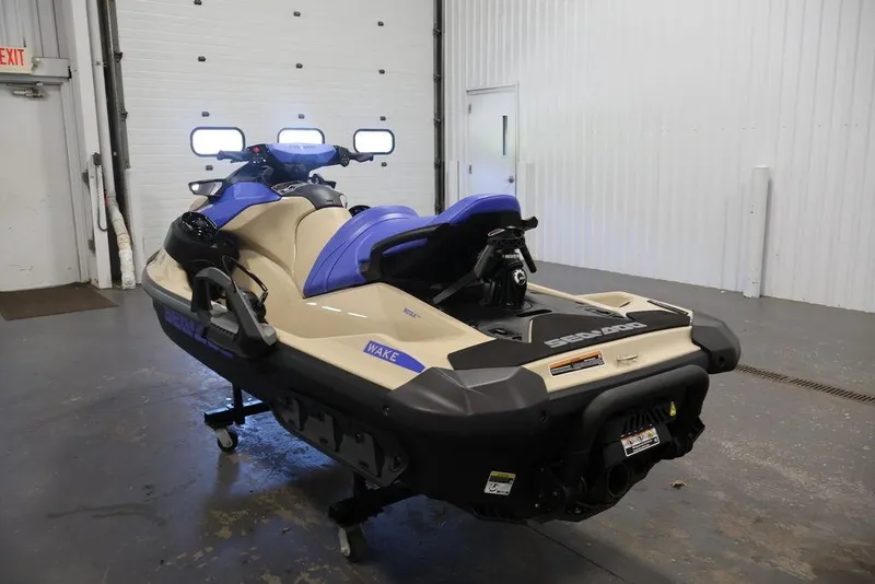 Slide: The Image of 2026 Sea-Doo Wake 170 jet ski in a garage, showcasing sleek design and vibrant colors. - 17