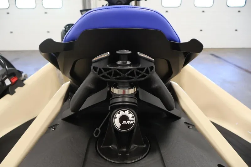 Slide: The Image of 2026 Sea-Doo Wake 170 handlebar and seat detail in a showroom setting. - 20
