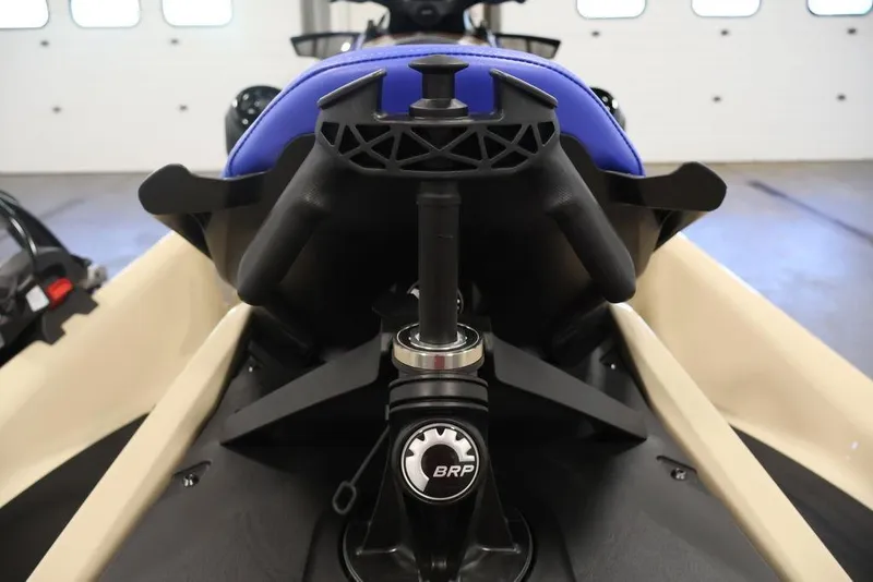 Slide: The Image of 2026 Sea-Doo Wake 170 jet ski seat and handle detail in a showroom. - 25