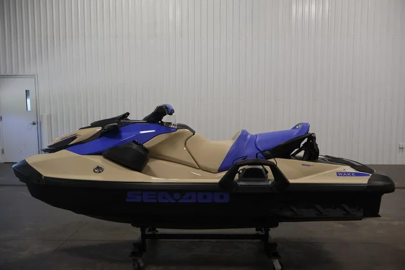 Slide: The Image of 2026 Sea-Doo Wake 170 jet ski in a showroom, featuring a sleek design. - 7